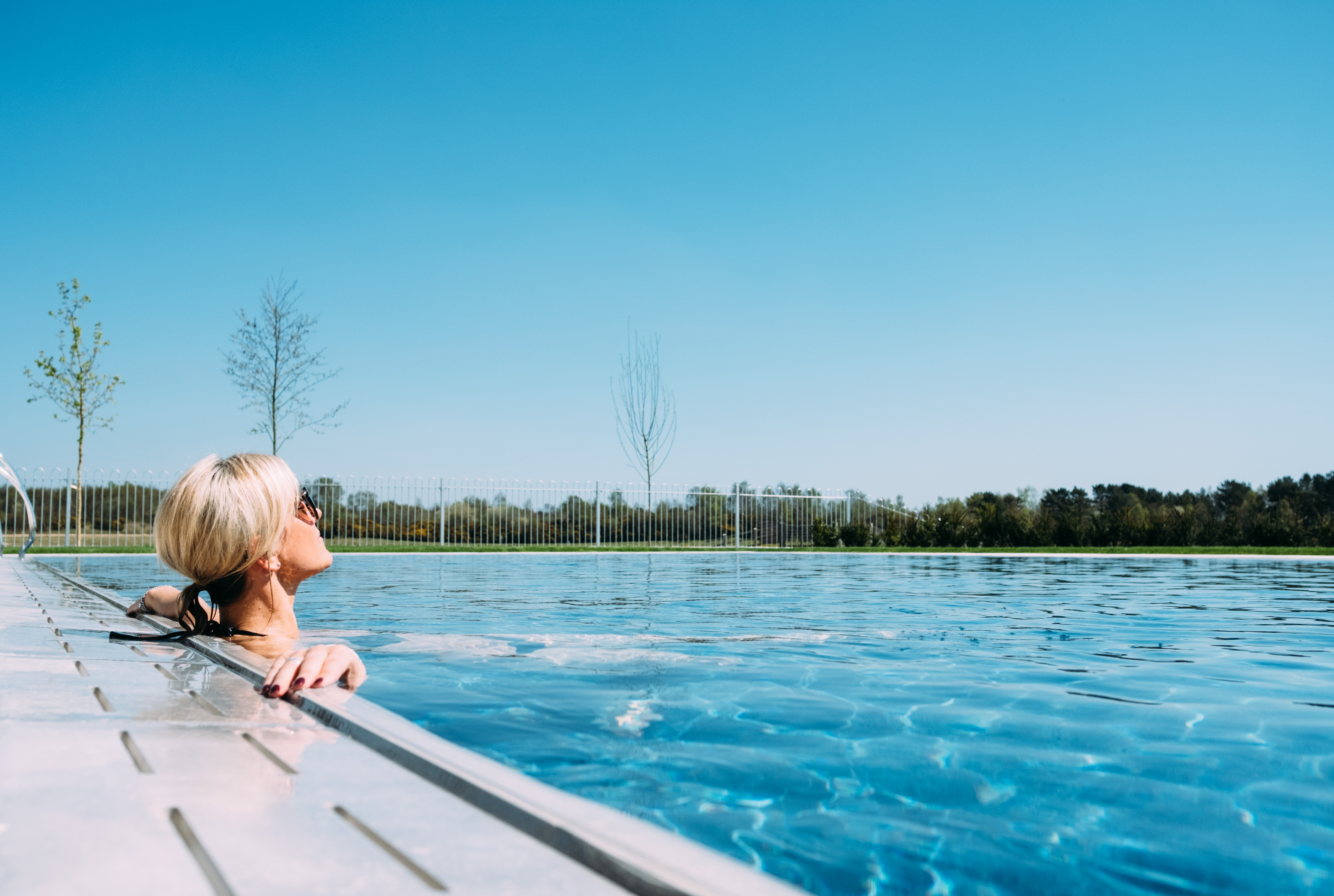Person with blonde hair relaxing in Silverlake's spa pool