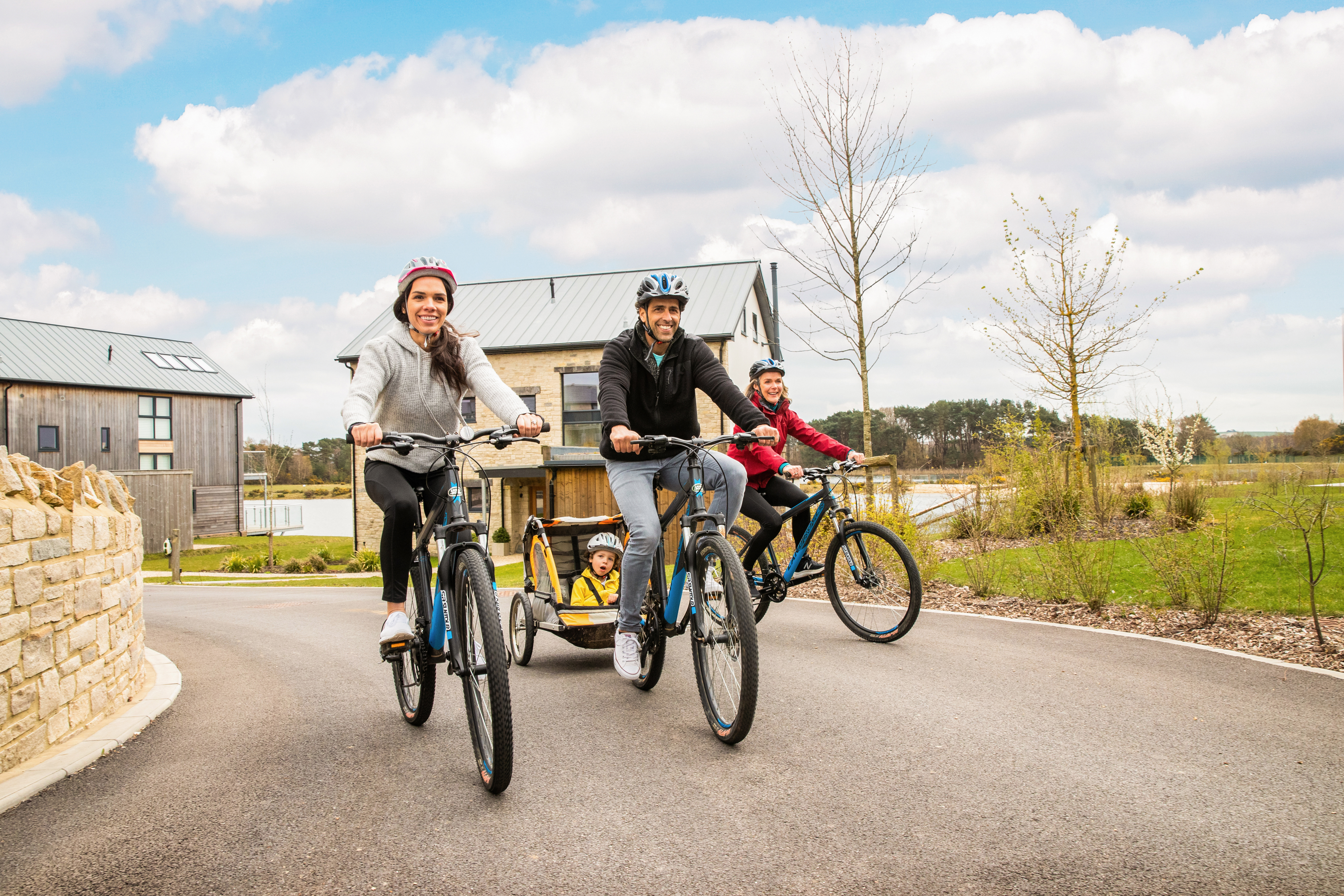 A family riding bikes through the Silverlake estate